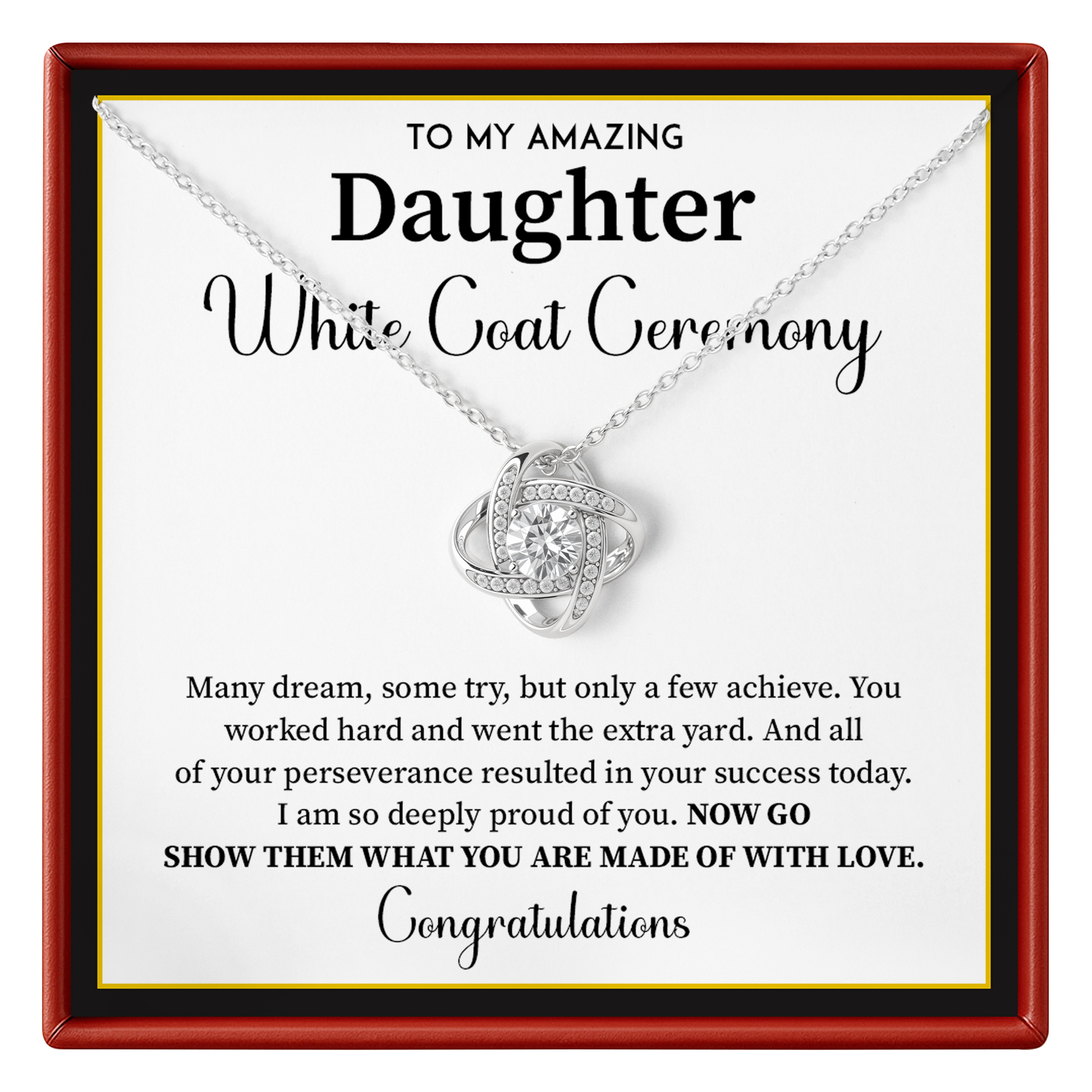 A silver necklace with a heart-shaped pendant set with small clear stones, presented on a white card with a red frame. The card reads 'TO MY AMAZING Daughter White Coat Ceremony' with a congratulatory message.