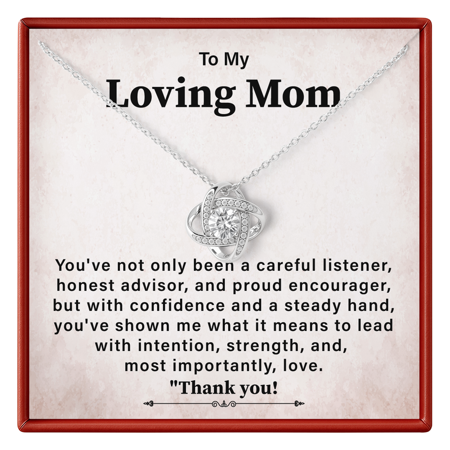 A silver necklace with a heart-shaped pendant displayed on a personalized gift card. The card has a red border and a warm beige background with a sentimental message addressed to 'Loving Mom'.