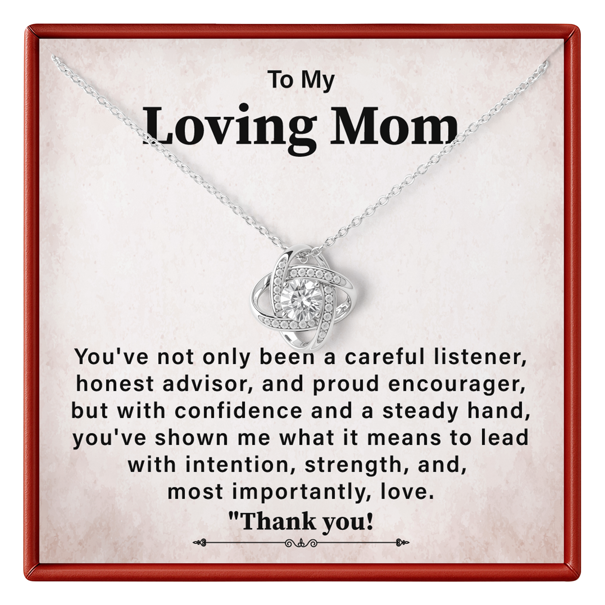 A silver necklace with a heart-shaped pendant displayed on a personalized gift card. The card has a red border and a warm beige background with a sentimental message addressed to 'Loving Mom'.