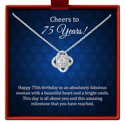 Silver necklace with a heart pendant in a decorative box with birthday message.