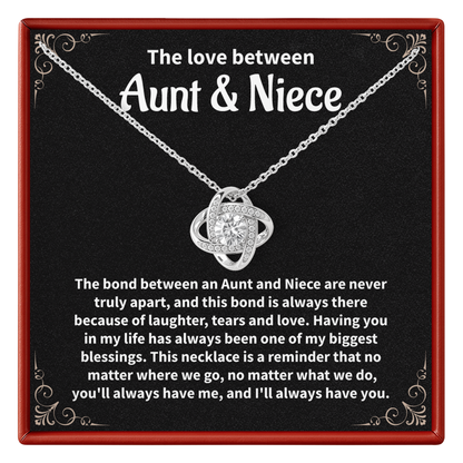 Necklace with sentimental message for aunt and niece on a black background