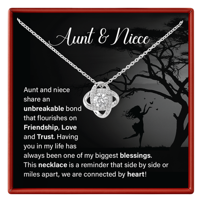 Necklace with heart pendant in a box with text about aunt and niece bond