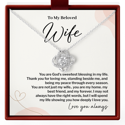 Sparkling Love Knot necklace, printed “To My Beloved Wife” Christian message card, and gift-ready presentation box.