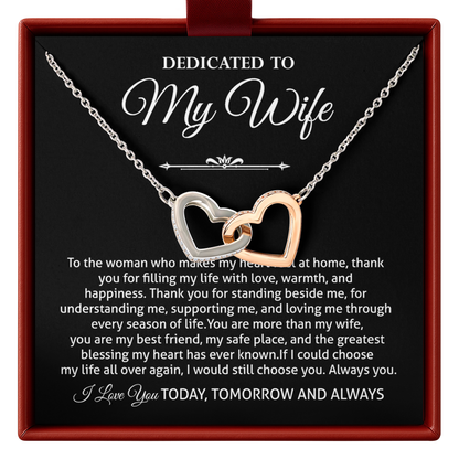 Two-tone interlocking hearts necklace, printed “Dedicated to My Wife” message card, and gift-ready presentation box.