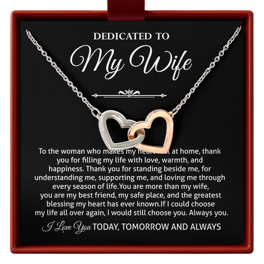 Two-tone interlocking hearts necklace, printed “Dedicated to My Wife” message card, and gift-ready presentation box.