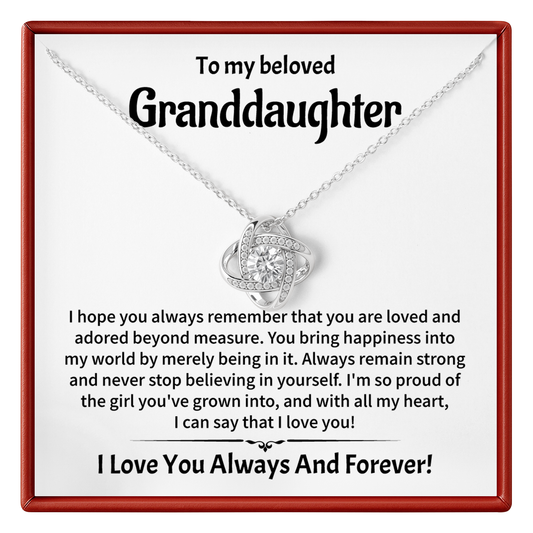 Necklace with heart pendant on a card addressed to a granddaughter, expressing love and pride.