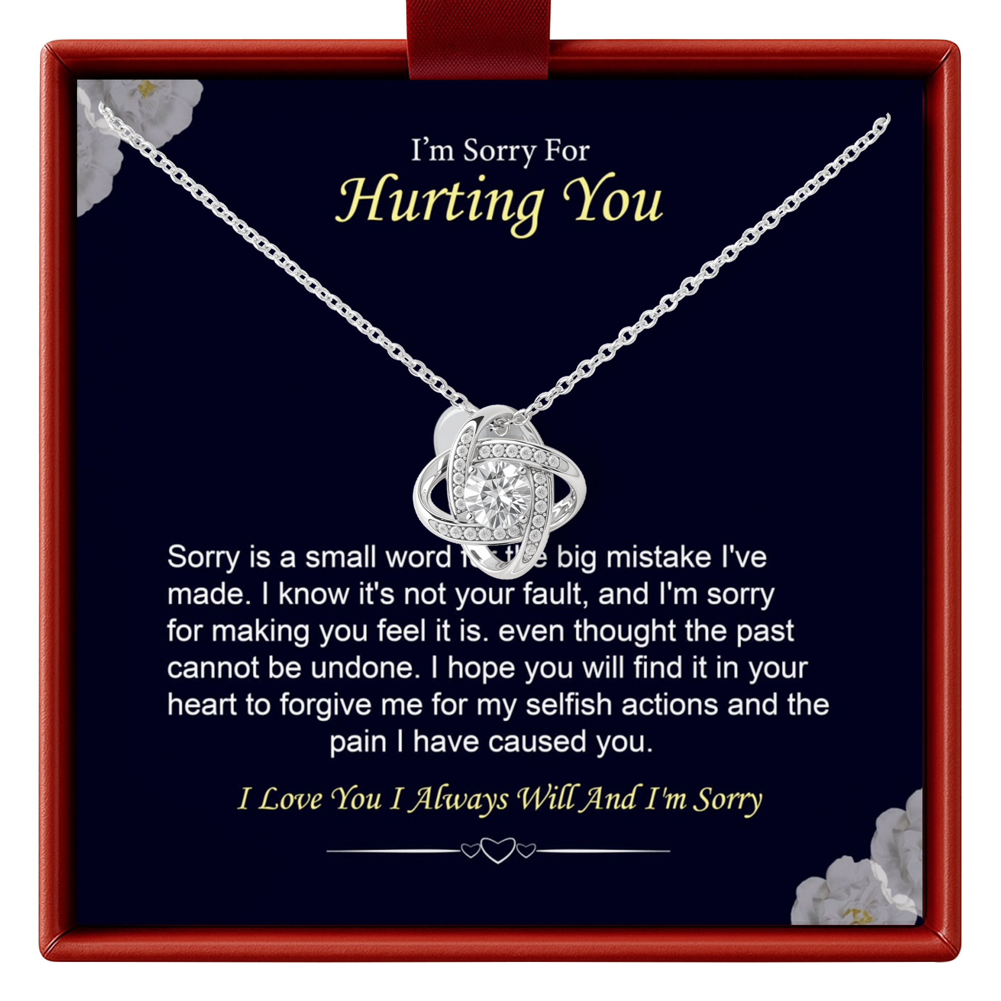 Necklace with a heart-shaped pendant in a box with an apology message.