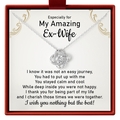 Necklace with a sentimental message card for an ex-wife in a decorative box.