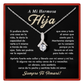 Necklace with a diamond pendant on a black card with Spanish text, framed by a red border.