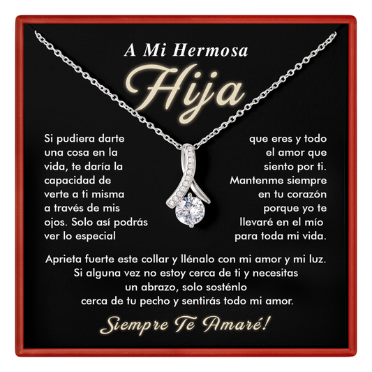 Necklace with a diamond pendant on a black card with Spanish text, framed by a red border.