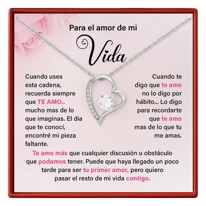 Necklace with heart design and sentimental message on a pink card