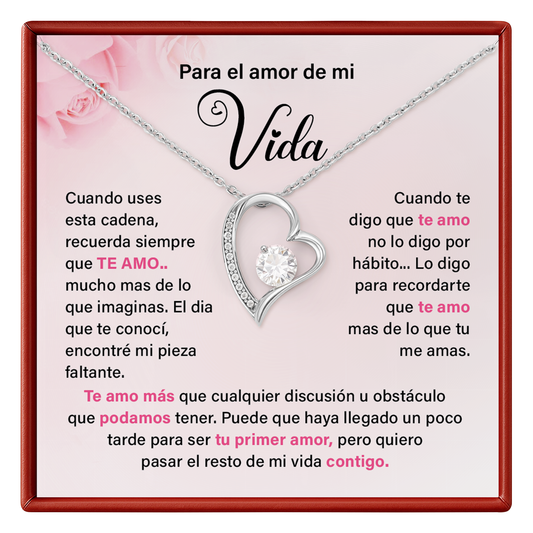 Necklace with heart design and sentimental message on a pink card