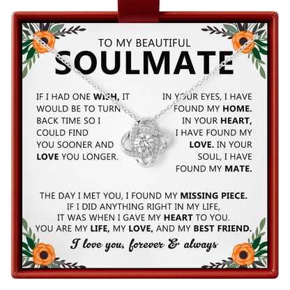 Necklace with a sentimental message card for a soulmate on a white background with floral decorations.