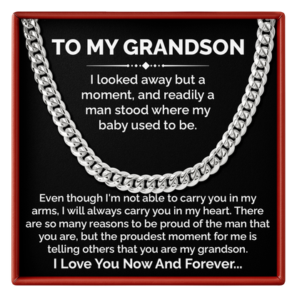 Silver chain necklace with a sentimental message for a grandson on a black background