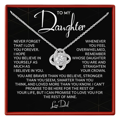 Necklace with a sentimental message card for daughter on a black background