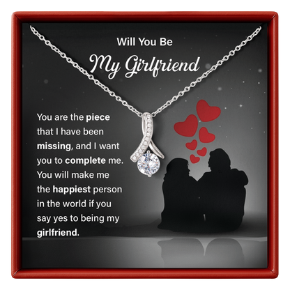 Necklace with heart-shaped pendant in a box with romantic message for girlfriend