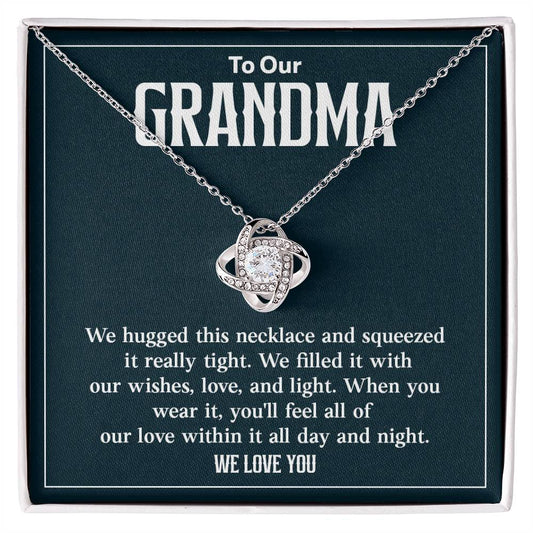 To Our GRANDMA We hugged this necklace and squeezed.