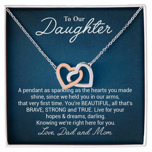 To Our Daughter A Pendant As Sparkling As The Hearts You Made Shine.