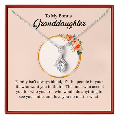 Necklace with a message card for a bonus granddaughter on a beige background